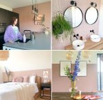 Black kitchen, bathroom with pink tiles and black mirrors, bedroom with pink wall, yellow vase with purple flower on dining table