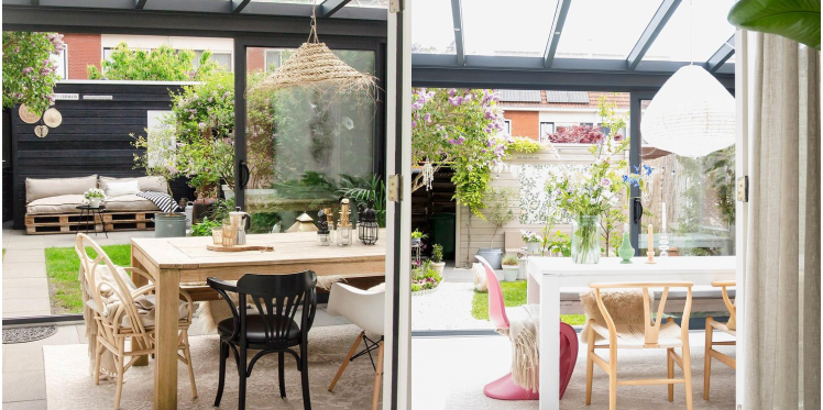 Before and after of garden room. Wooden table with black dining chair. White wooden table with light dining chair and a pink chair. 